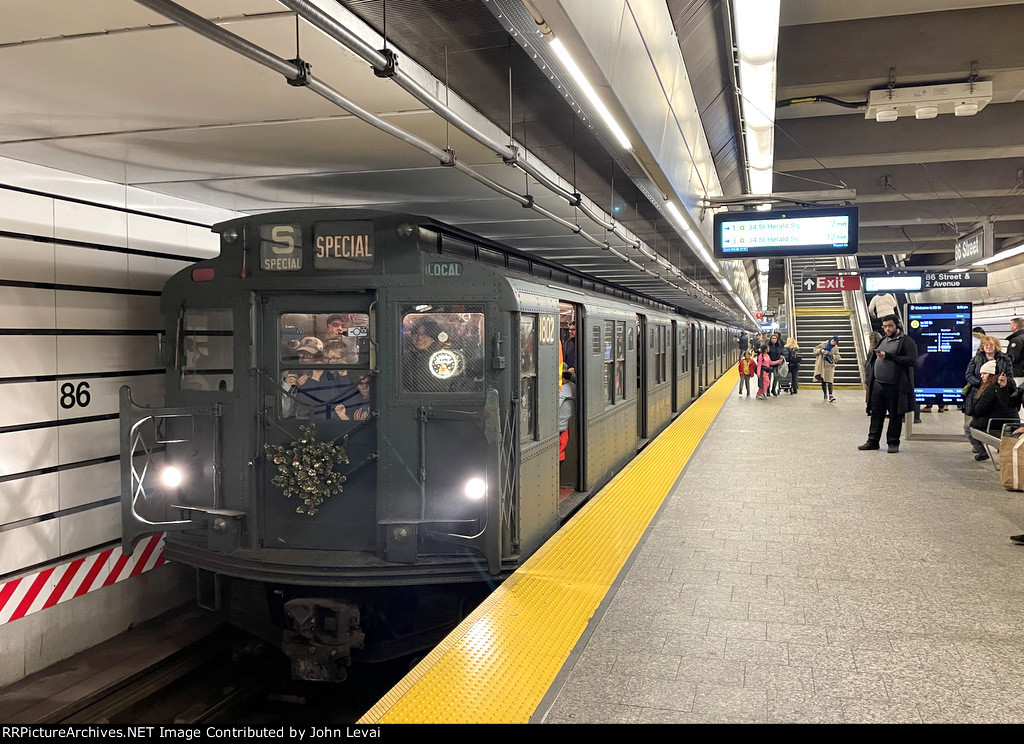 Northbound NYCTA Holiday Train Set of Arnine Cars at 86th St Station on the Q Line 